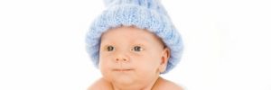 baby in blue knitted hat