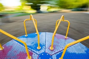 merry go round spinning on playground